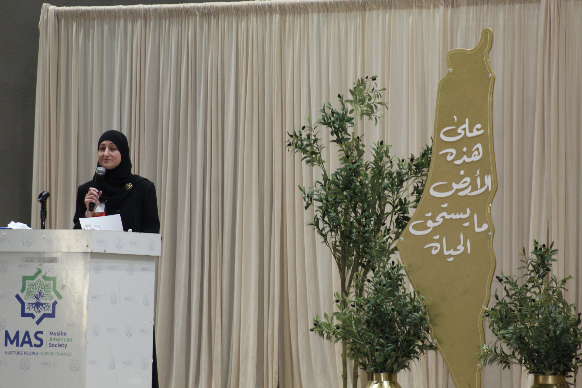 Amaal Aref speaking at the 2nd Annual Palestine Educational Conference at MAS Dallas